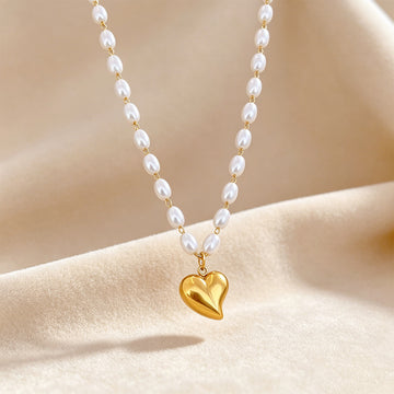 Three-layer gold necklace with hearts