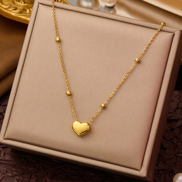 Three-layer gold necklace with hearts