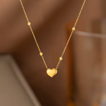 Collar de corazon dorado con esferas