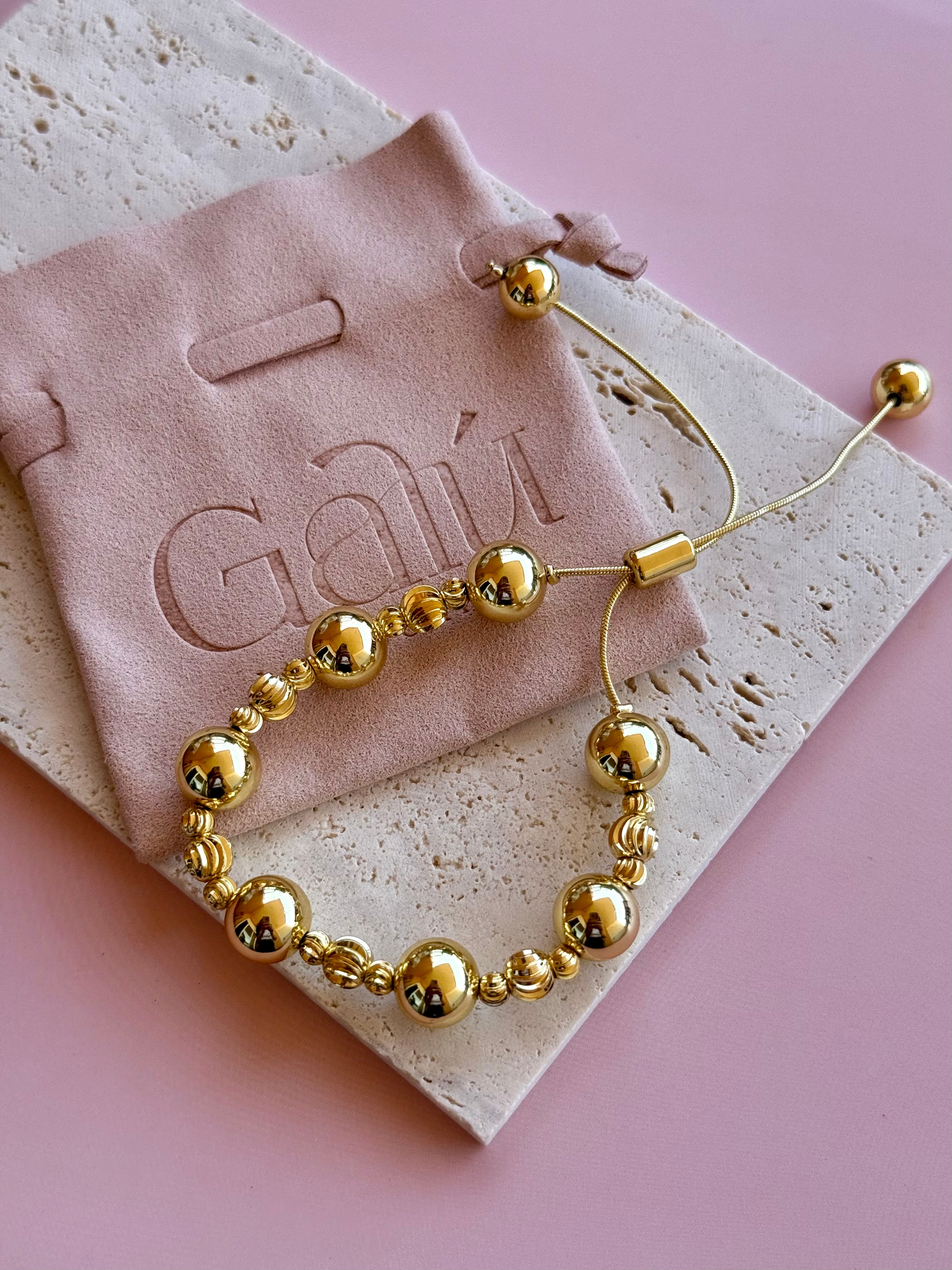 Pulsera de Esferas Doradas