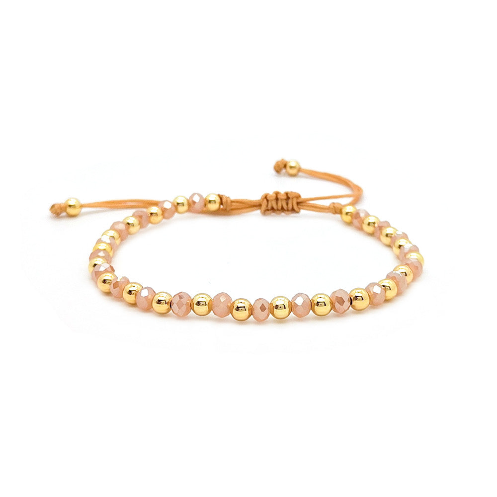 Brazalete de cuentas doradas y rosadas