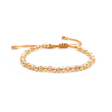 Brazalete de cuentas doradas y rosadas