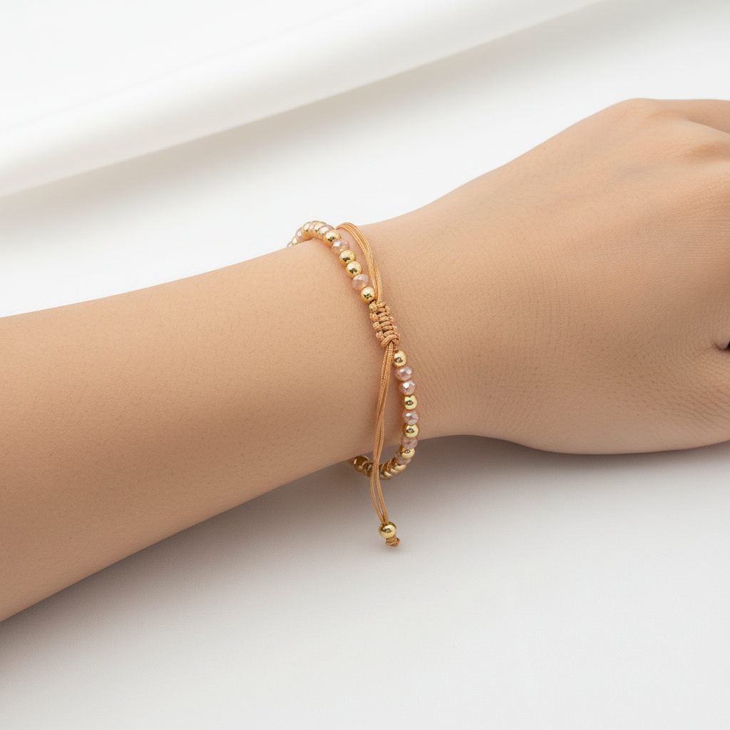 Brazalete de cuentas doradas y rosadas